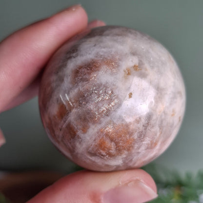 Black Moonstone with Sunstone Sphere - 129 grams
