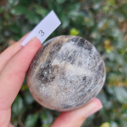 Black Moonstone Palm Stone - Madagascar - Nice flash!