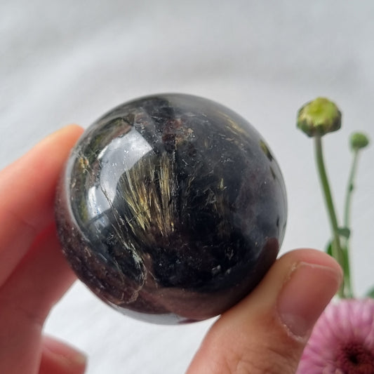 Arfvedsonite & Astrophyllite in Garnet Sphere - 153g